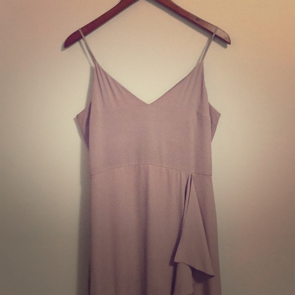 Floor length mauve dress.